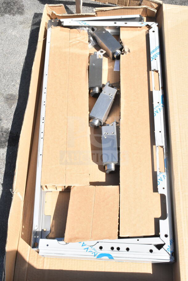 Brand new 2023 Blodgett Invoq Hybrid 6-1/1 GN combi convection oven parts in packaging, showing metal components.