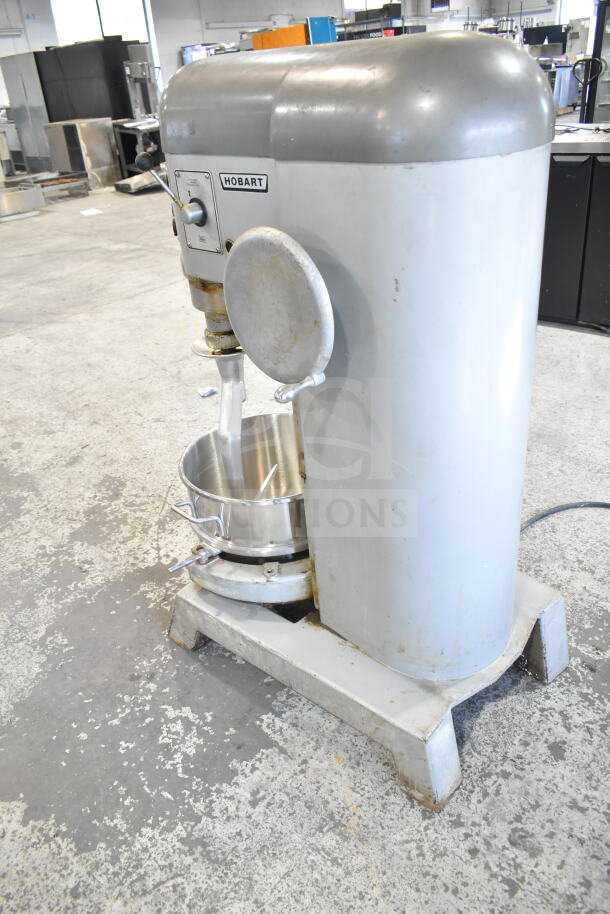Hobart P 660 commercial floor mixer with 60-quart bowl and dough hook. 208-240V, 3 phase. Visible wear on base.