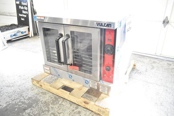 "New Vulcan commercial full-size convection oven with view-through doors, thermostatic controls, minor scratches."