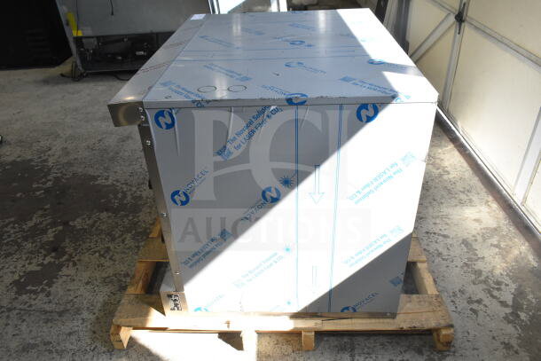 Brand new Vulcan commercial convection oven, full-size, scratch and dent condition, with protective wrapping, on pallet.