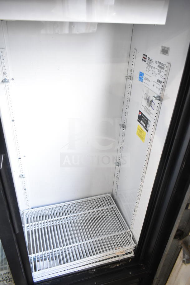 True GDM-41SL-60-LD commercial 2-door cooler merchandiser, 115 volts, interior shelves visible, excellent condition.