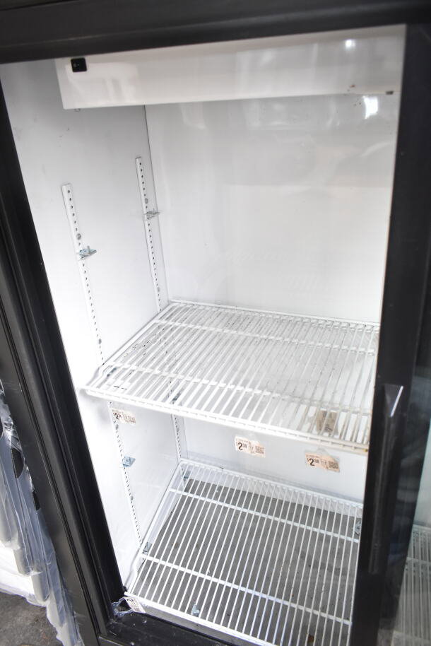 True GDM-41SL-60-LD commercial cooler with two glass doors, white interior, adjustable shelves, 115V, for reach-in merchandising.