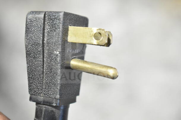 2017 True T-35 Commercial Cooler plug, 115 Volts, 1 Phase, close-up of power plug, textured black casing.