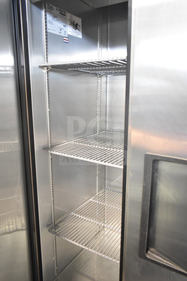 2017 True T-35 commercial 2-door reach-in cooler with shelves, on casters, 115 volts, 1 phase, excellent condition.