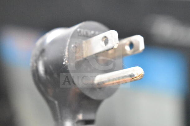 Close-up of a power plug for a 2021 True TSCI-600R-G-PH Commercial Single Door Reach In Cooler Merchandiser.