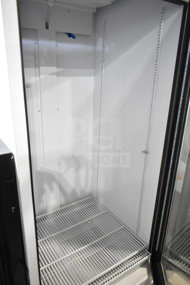 2021 True TSCI-600R-G-PH commercial cooler, single glass door, white interior, adjustable shelving, 115V, excellent condition.