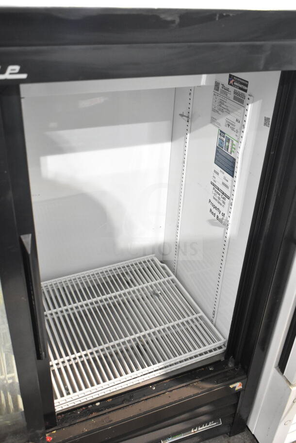 2020 True GDM-41C-48-HC-LD cooler merchandiser with 2 glass doors, 115V, labels inside, white interior, good condition.