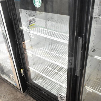True GDM-10 commercial single door cooler merchandiser, 115 volts, features glass door, white interior shelving, model label visible.