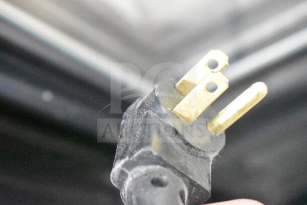 Close-up of a power plug for True GDM-10 Commercial Single Door Cooler Merchandiser, 115 Volts, 1 Phase.