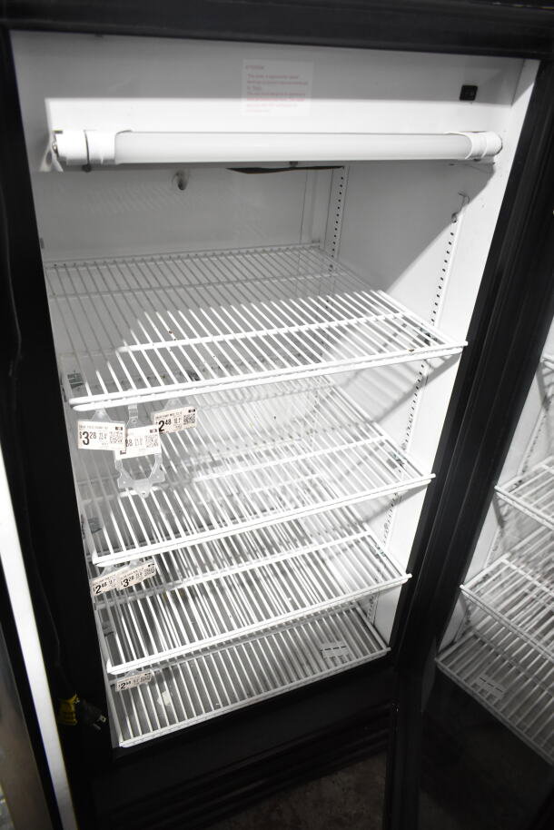 True GDM-10 commercial reach-in cooler, single door, 115 volts, interior racks, clean condition, labels attached.