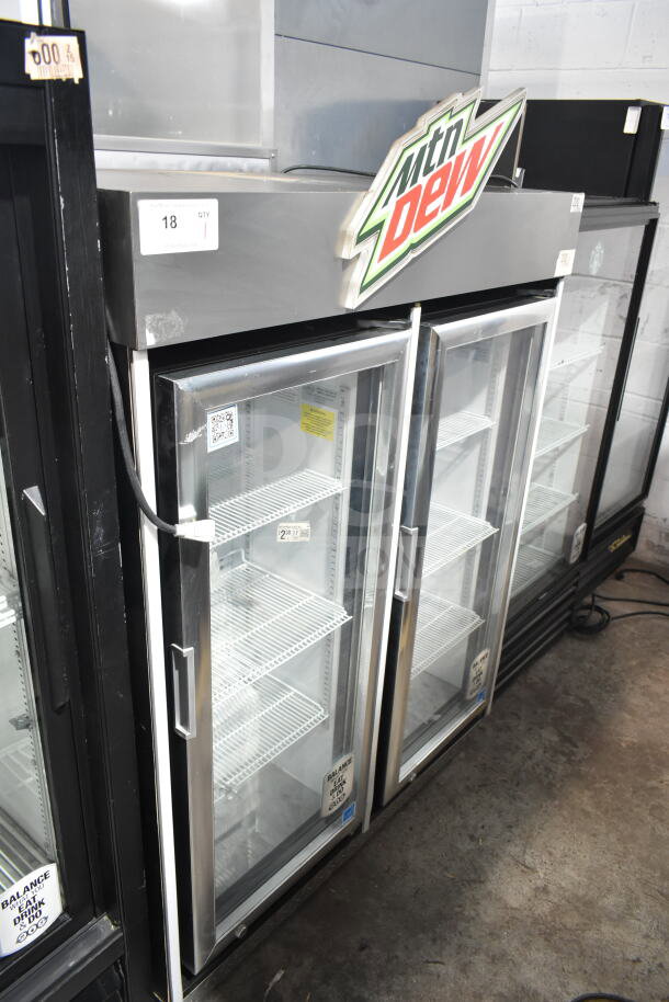2019 IDW G4-H0234B single door reach-in cooler, 115V, 1 phase. Features glass door, interior shelves, Mountain Dew sign.