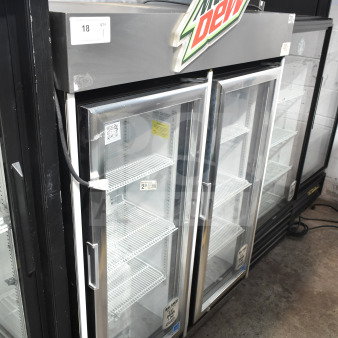 2019 IDW G4-H0234B single door reach-in cooler, 115V, 1 phase. Features glass door, interior shelves, Mountain Dew sign.