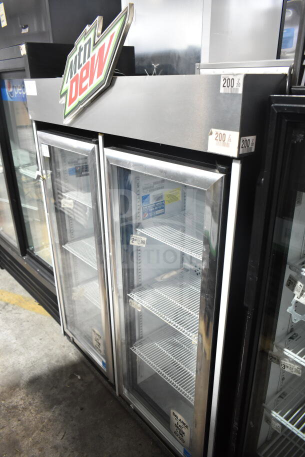 IDW G4-H0234B Commercial Single Door Cooler, 115V, used, glass door, interior shelves, Mountain Dew branding, auction lot.