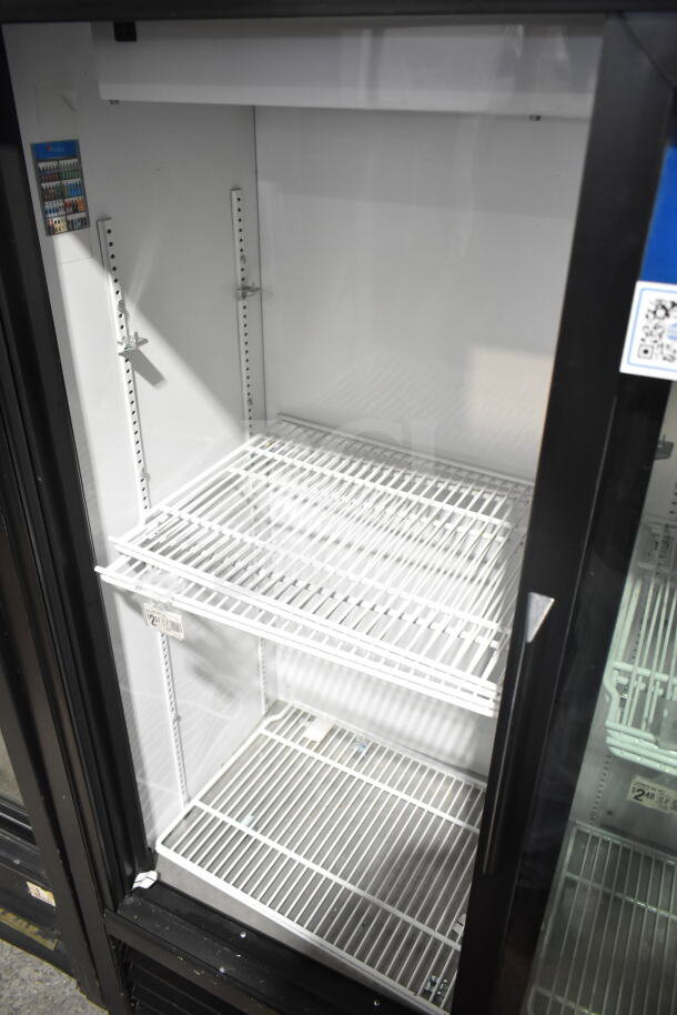 True GDM-41SL-60-LD cooler merchandiser, 2-door, shelves inside, 115V, good condition, commercial use.