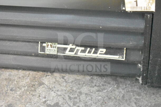 True GDM-41SL-60-LD cooler, 2-door, commercial merchandiser. "True" logo visible on black trim. 115V, 1 phase.