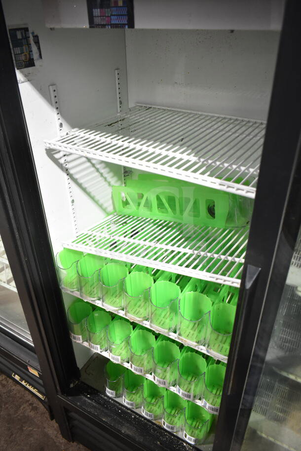True GDM-41SL-60-LD commercial cooler, two-door, white interior, green organizers, 115V, 1 phase. Clean condition.