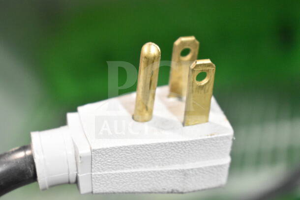 Close-up of a True GDM-41SL-60-LD cooler power plug, showing a standard three-prong design for 115 volts, 1 phase.