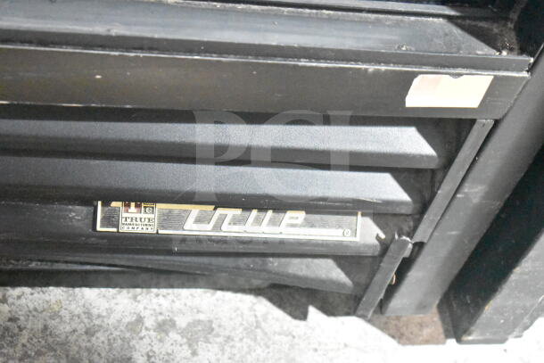 True GDM-41SL-60-LD commercial cooler, black finish, True logo, 115 volts, 1 phase. Good condition.