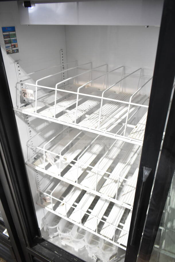 True GDM-41SL-60-LD commercial 2-door cooler, white shelves, interior light, 115 volts, clean, good condition.