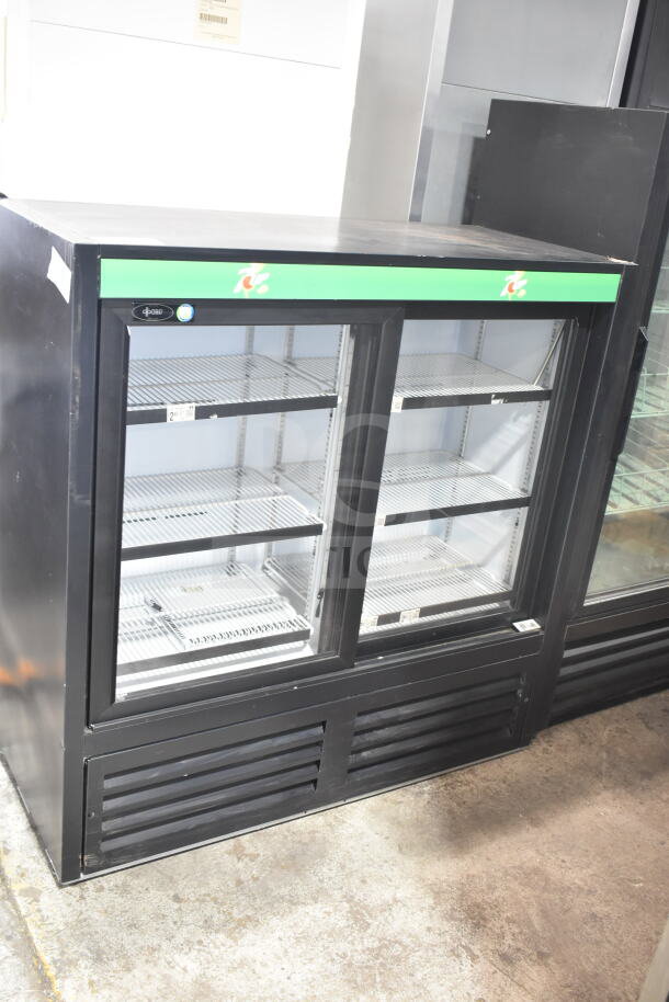 QBD CD4148SL-HC commercial 2-door reach-in cooler. Features glass doors, metal shelving. 115V, single phase.