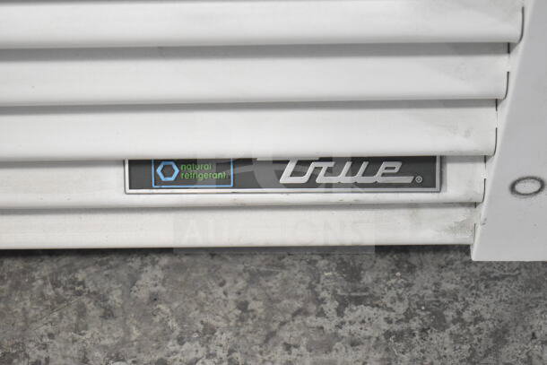 2021 True TSCI-600R-G-PH cooler badge showing natural refrigerant marking, white exterior.