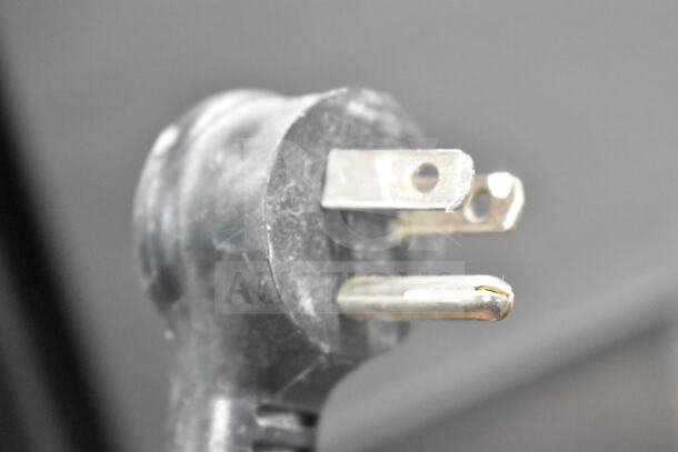 Close-up of the power plug for the True T-19F commercial freezer, showing a standard three-prong configuration.
