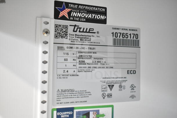 2023 True GDM-26-HC commercial reach-in cooler label, showing model, voltage, refrigerant, and certifications.