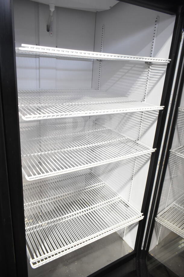 2023 True GDM-26-HC single door reach-in cooler merchandiser, white interior, four adjustable shelves, 115V, excellent condition.