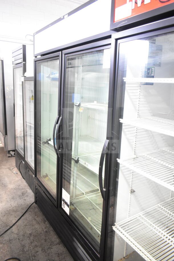 2021 True GDM-49F-HC 2 Door Commercial Cooler Merchandiser, 115V, 1 Phase, glass doors, shelving visible, good condition.