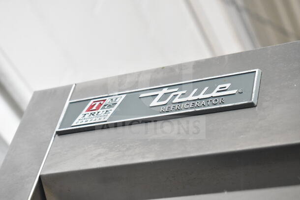 2017 True T-35 Commercial Cooler, logo badge. Stainless steel, 2-door, 115V, 1 phase. Durable with True branding.