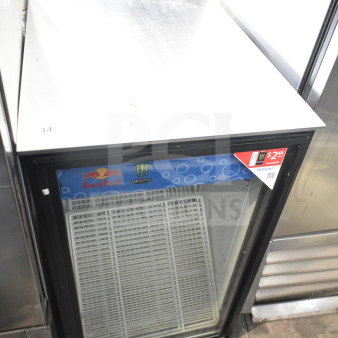 True GDM-06-LD Mini Cooler Merchandiser, 115V, with Red Bull and Monster branding, glass front, good condition.