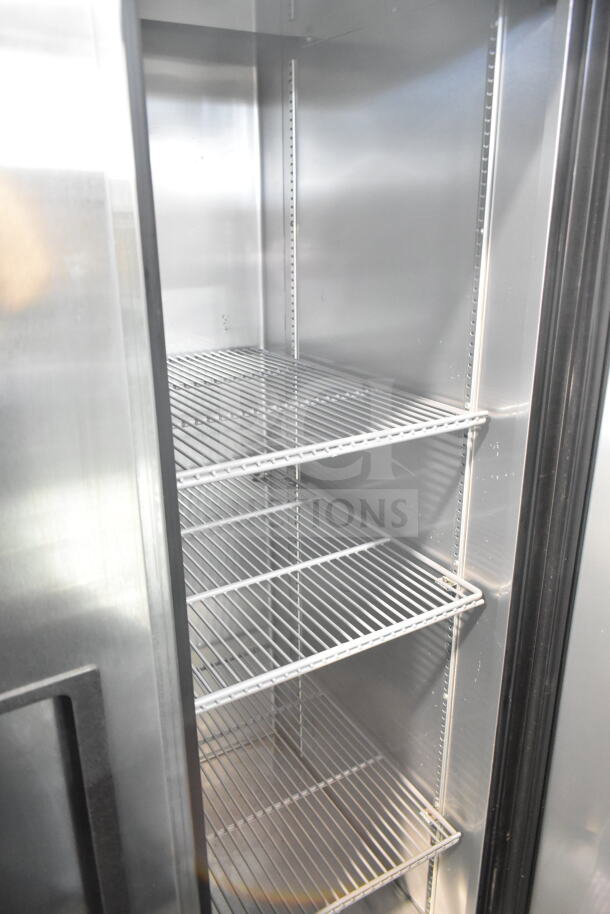 2017 True T-35-HC commercial 2-door reach-in cooler, stainless interior, adjustable wire shelves, on casters, 115V, 1 Phase.