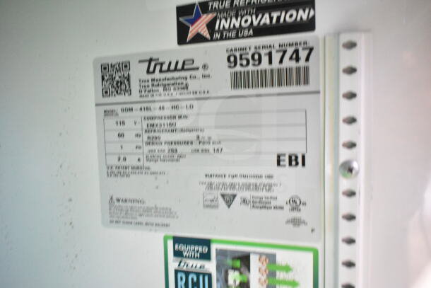 2019 True GDM-41SL-48-HC-LD Commercial Cooler tag, 115 volts, model info and specifications visible.