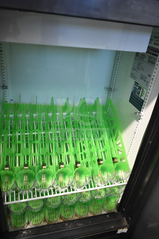 2019 True GDM-41SL-48-HC-LD reach-in cooler, 2-door, green shelves, visible interior labels, 115V, 1 phase.