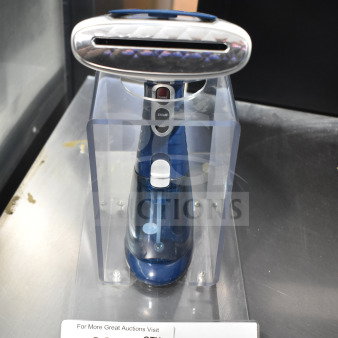 Blue handheld steamer in stand, features turbo and steam settings. Auction tag number 38 visible.