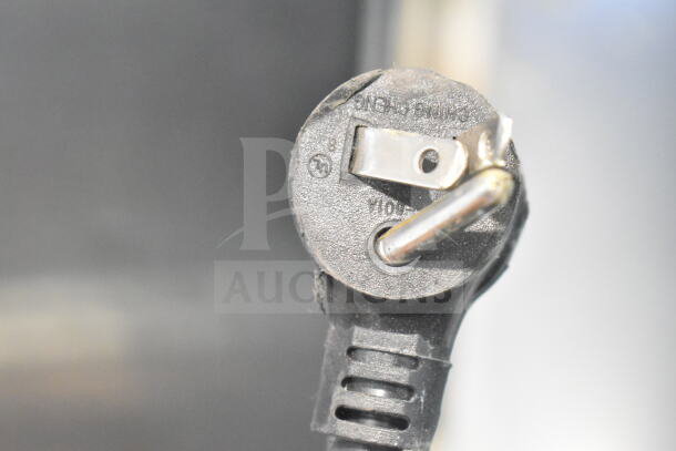 Close-up of the power plug for a 2018 True GDM-06-34-HC Mini Cooler Merchandiser, 115 Volts, 1 Phase.