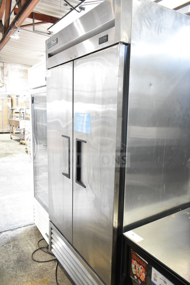 2017 True T-35-HC Commercial 2 Door Reach-In Cooler, stainless steel, on casters, 115V, 1 phase, model label visible.