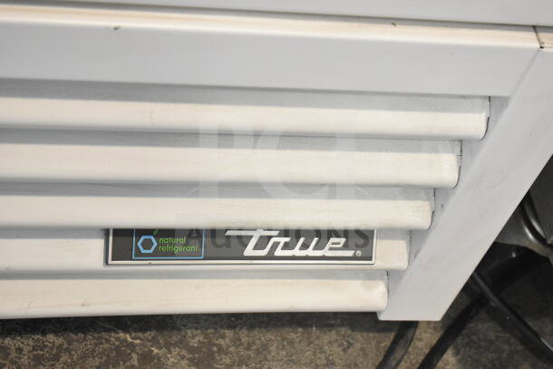 2021 True TSCI-600R-G-PH commercial cooler, single door, 115 volts, natural refrigerant label, white exterior.