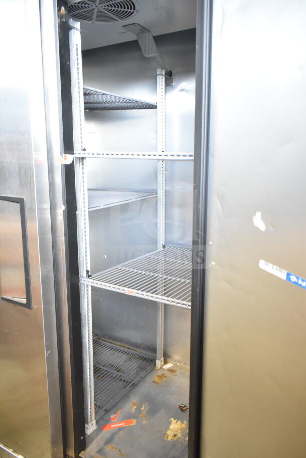 2022 True T-35-HC commercial reach-in cooler, 2 doors, on casters, 115V, 1 phase, showing interior shelving and condition.