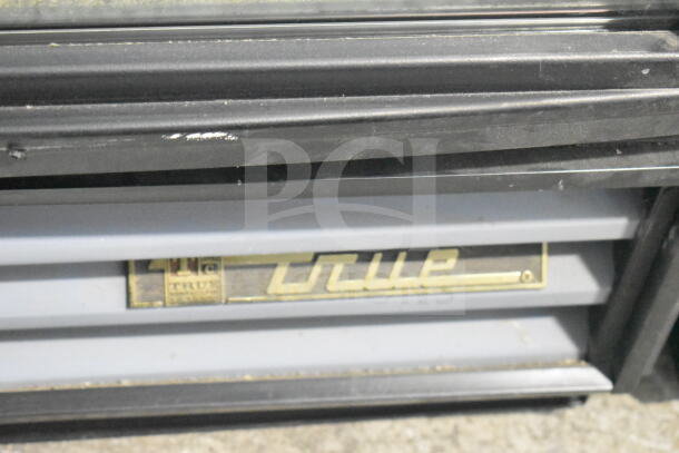 True GDM-12-LD Commercial Cooler, single door, reach-in, 115 volts, visible brand label, in used condition.