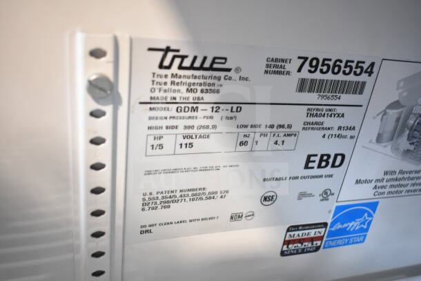 True GDM-12-LD cooler label showing model, voltage 115V, phase 1, and refrigerant details. Energy Star logo visible.