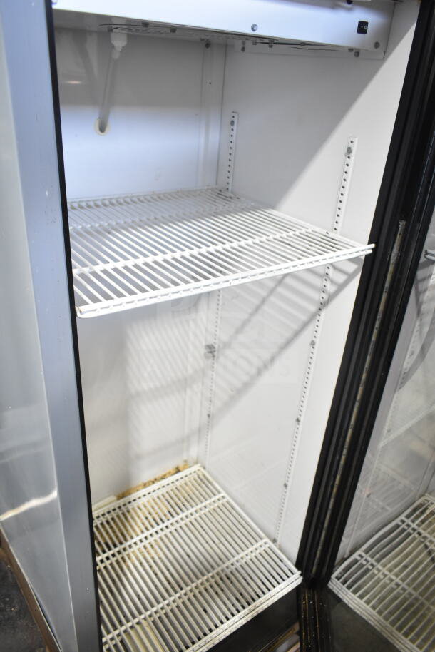 True GDM-12-LD single door cooler, white interior, metal shelves, 115V, 1 phase. Visible minor wear on shelves.