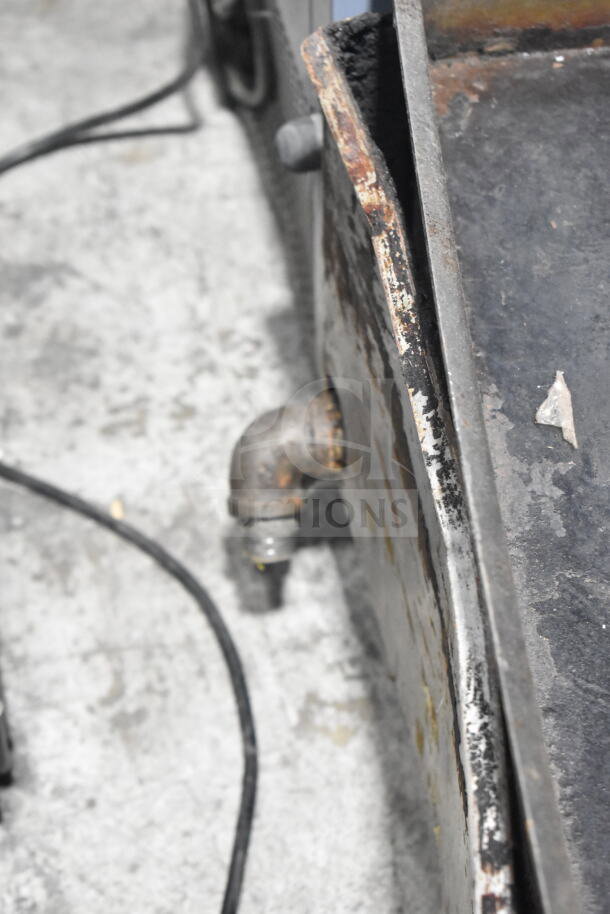 APW Wyott Champion gas-powered griddle, commercial countertop model, visible wear, rust on edges, gas inlet shown.