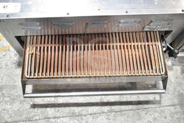 Imperial Commercial Gas Powered Cheese Melter with a stainless steel finish and visible signs of wear.