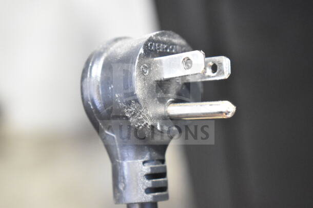 A close-up of a power plug for the 2021 True GDM-49-HC Commercial 2 Door Reach In Cooler, 115 Volts, 1 Phase.