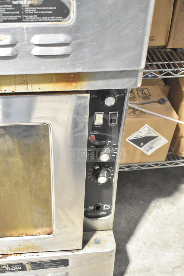 2 Blodgett commercial full-size convection ovens with view-through doors and thermostatic controls on commercial casters.