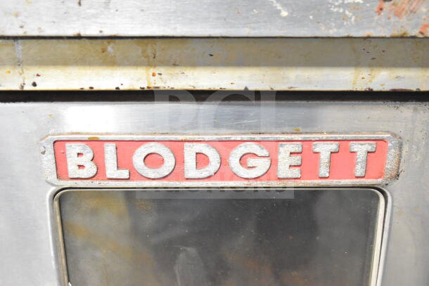 Blodgett oven with view-through doors, visible brand logo, thermostatic controls, on commercial casters, used condition.