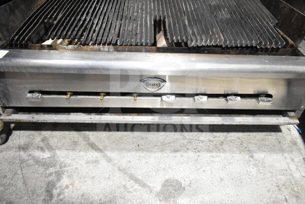 Wells Commercial Countertop Gas Charbroiler Grill. Stainless steel, six control knobs, used condition, Wells logo visible.