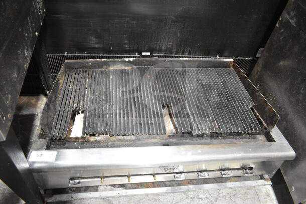 Wells commercial countertop gas-powered charbroiler grill in used condition, featuring a wide grilling surface and control knobs.