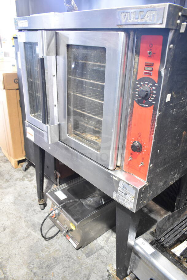 Vulcan Wells VC4GD-11D350K convection oven with view-through doors, thermostatic controls, metal legs, and commercial casters.
